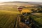 breathtaking view of a vineyard and a cozy tasting room from a hot air balloon