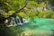 Breathtaking waterfalls panorama in Plitvice Lakes National Park, Croatia, Europe. Majestic view with turquoise water and sunset