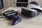 Brecht, Belgium - June 12 2019; A playstation 4 VR headset together with a playstation 4 controller and two move controllers on a