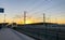 Brecht, Belgium - June 2019: A commuter train in the Noorderkempen railway station in Brecht at sunrise