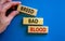 Breed bad blood symbol. Businessman holds wooden block with words `Breed bad blood`. Beautiful blue background, copy space.