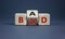 Breed bad blood symbol. Turned cubes and changed the word `bad` to `blood`. Beautiful grey background, copy space. Business, b