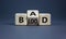 Breed bad blood symbol. Turned cubes and changed the word `bad` to `blood`. Beautiful grey background, copy space. Business, b