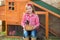 Breeder hens kid girl rancher farmer with chicks in chicken coop