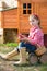 Breeder hens kid girl rancher farmer with chicks in chicken coop