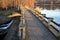 Breeding pond dam. water flows under a stone bridge with several arches. bridge on the crown of the dam with canals for drainage o