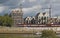 Bremen, Germany - September 14th, 2017 - Riverside construction site with cranes, partly and fully completed residential buildings