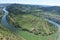 Bremm, Germany - 08 20 2020: view from the Calmont across a Mosel curve with monastery ruin near Bremm, Kloster Stuben