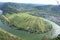 Bremm, Germany - 08 20 2020: view from the Calmont to the vineyards with monastery ruin near Bremm, Kloster Stuben