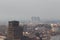 Brescia cityscape, buildings in fog, Lombardy, Italy