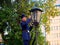 BREST, BELARUS - August 17, 2022: st. Soviet lamplighter lights kerosene lamps of street lamps