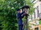 BREST, BELARUS - August 17, 2022: st. Soviet lamplighter lights kerosene lamps of street lamps