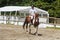 BREST, FRANCE - JUNE 28 : man riding a pinto horse, June 28, 2019