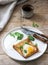 Breton buckwheat crepes with egg, spinach and cream, filed with the coffee. Rustic style