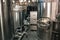 Brewery manufacturing factory. Stainless steel vats or tanks with pipes, small brewing equipment, modern alcohol production