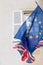 Brexit blue european union EU europe flag on building wall and great britain flag