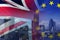 BREXIT conceptual image of London image and UK and EU flags overlaid symbolising agreement and deal being processed
