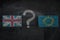 Brexit, flags of the United Kingdom and the European Union with question mark between on blackboard