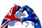 Brexit, hands of man in heart shape patterned with the flag of blue european union EU and flag of great britain uk on europe map