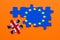 Brexit jigsaw puzzle concept on orange background