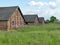 Brick barracks in the meadow in the former concentration camp. Auschwitz, Birkenau