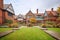 brick base tudor mansion with sprawling grounds