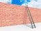 Brick block wall and ladder over sky background.Success concept