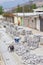 Brick blocks for road repairs along Museo Solar, San Antonio, Midad del Mundo, Quito.The workers lay the road from the brick tile.