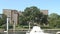 A brick building overlooking boat docks.