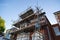 a brick building surrounded by scaffolding poles ready for construction work to take place