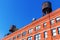 Brick building with typical water tanks on the roof in NYC