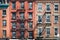 Brick buildings with outside fire escape stairs, USA