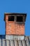 Brick chimney on the rooftop, close up