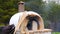 brick, clay oven fire outdoor in forest garden background