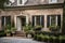 brick exterior with shutters and window boxes