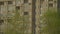 Brick Facade and balconies of a residential multi-storey building on a sunny day. Panorama