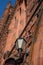 The brick facade and entrance lamps of an old historic church wi