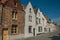 Brick facade of houses in street of Bruges