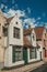 Brick facade of houses in typical style of the Flandersâ€™s region in street of Bruges.