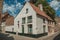 Brick facade of houses in typical style of the Flandersâ€™s region in street of Bruges.