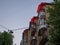 Brick facade of a soviet building with fancy balconies shelters