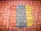 Brick floor with shield pattern in 3 colors, Red, grey and yellow.