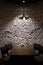 Brick grunge wall and ceiling lamp above table