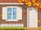 Brick house facade in autumn season