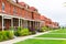 Brick house with gently slanted lawn.