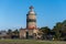 A brick lighthouse with a bright blue sky in the background. Picture of Falsterbo Lighthouse from 1796 in Scania