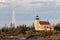 Brick Lighthouse with Red Roof in Warm Light