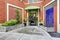 Brick residential building. Entance porch with waterfall