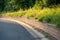 Brick retaining wall on a curve of a paved road