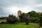 Brick round tower of Wawel castle residency in park landscape in Krakow, Poland